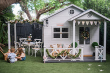 Load image into Gallery viewer, My Little Manor white timber pergola attached to white cubby house. Decorated for Easter
