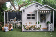 My Little Manor white timber pergola attached to white cubby house. Decorated for Easter