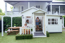 Load image into Gallery viewer, White pergola attached to white cubby house. Three young girls play in cubby house.
