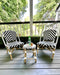 Children's black & white provincial french style chairs and stool with coffee and muffin. Provincial style children's rattan stool and chairs