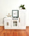 Children's Hamptons shaker style white play kitchen with gold fixtures and decorated with easter decorations. White toy kitchen